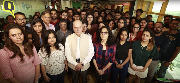 Journalist Raghav Bahl, center, is seen in this screen grab with staff at The Quint. Tax officials raided the website's offices and Bahl's home on October 11.