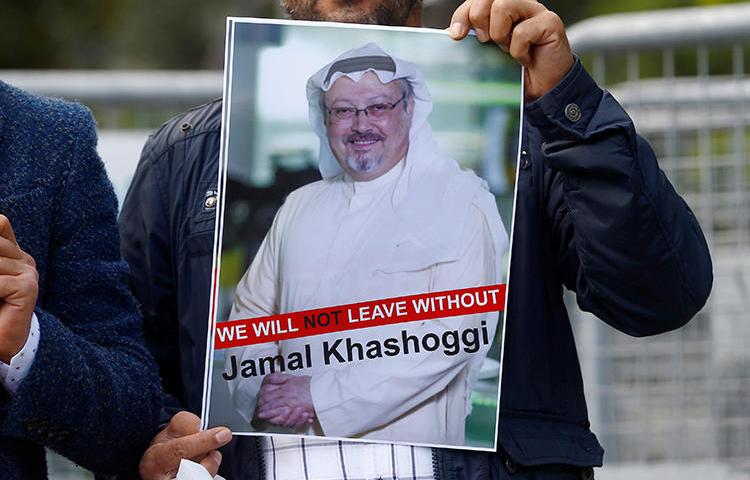 A demonstrator holds a picture of Saudi journalist Jamal Khashoggi during a protest in front of Saudi Arabia's consulate in Istanbul, Turkey, on October 5, 2018. Khashoggi has not been seen since entering the consulate on October 2. (Reuters/Osman Orsal)