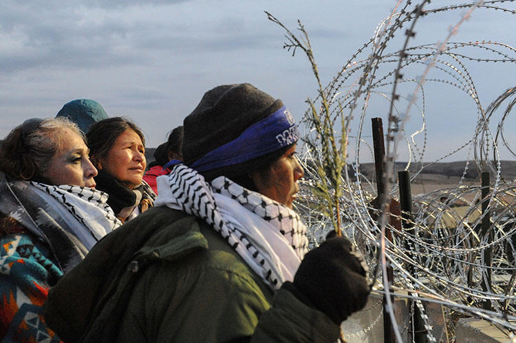 A prayer ceremony at Backwater Bridge, during the Dakota Access-Standing Rock protests, in November 2016. Journalist Ed Ou was denied entry to the U.S. while traveling to cover the protests. (Reuters/Stephanie Keith)