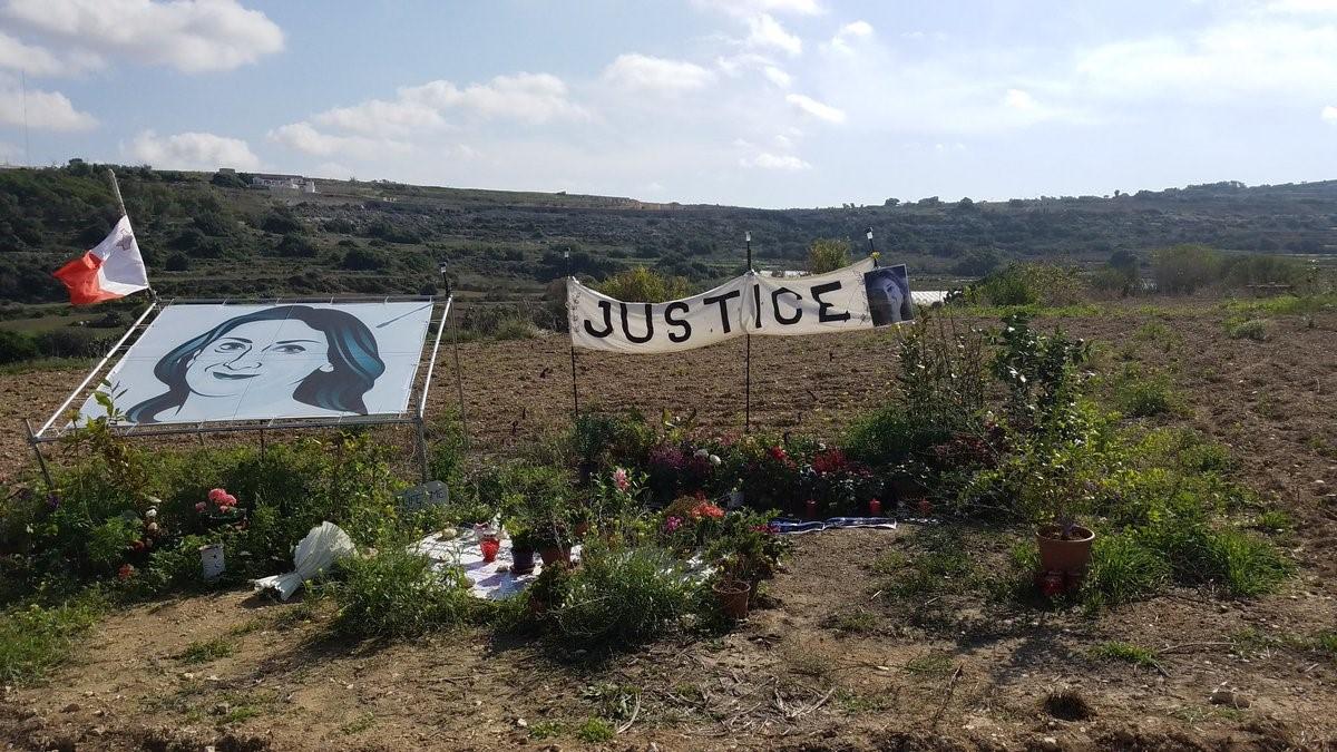 A memorial for journalist Daphne Caruana Galizia on October 16, 2018, to mark the first anniversary of her assassination, on the road where her car exploded. (CPJ/Courtney Radsch)