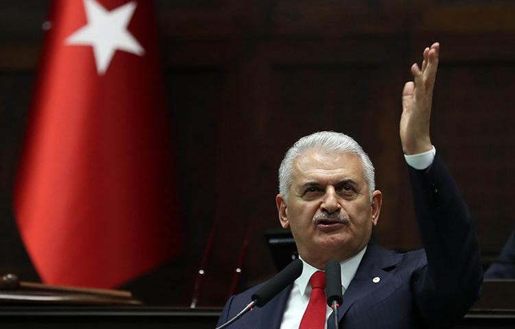 Binali Yıldırım, pictured giving a speech at Turkey's Grand Assembly in March 2018. A court ordered the daily Evrensel to pay damages to the former prime minister over its caricature of him. (AFP/Adem Altan)