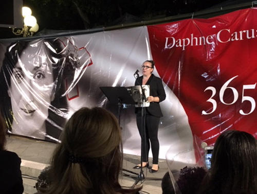 CPJ Advocacy Director Courtney Radsch speaks at a vigil on the one-year anniversary of the murder of Maltese journalist Daphne Caruana Galizia. (CPJ)