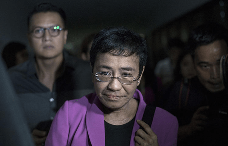 Maria Ressa, the founder of Rappler, arrives at the National Bureau of Investigation headquarters in Manila on January 22, 2018. Ressa says she believes the news website is being harassed because of its critical coverage of the president of the Philippines. (AFP/Noel Celis)