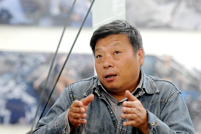 Lu Guang, pictured at the Pingyao International Photography Festival in Shanxi province in September 2014. Chinese police detained the photographer in early November. (Reuters/China Stringer Network)