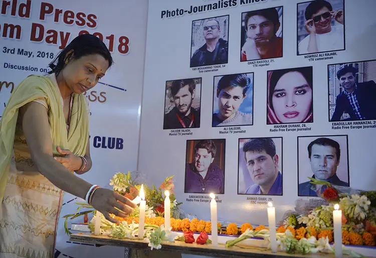 A vigil for 10 Afghan journalists who were killed in a targeted suicide bombing on April 30, 2018. (AFP/Diptendu Dutta)