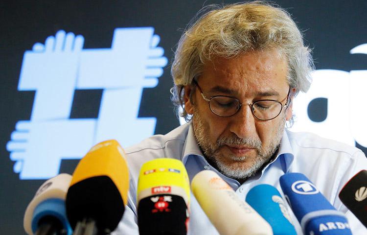 Turkish journalist Can Dündar, pictured at a press conference in Berlin in September. Turkey has issued a new arrest warrant for the former chief editor. (AFP/David Gannon)