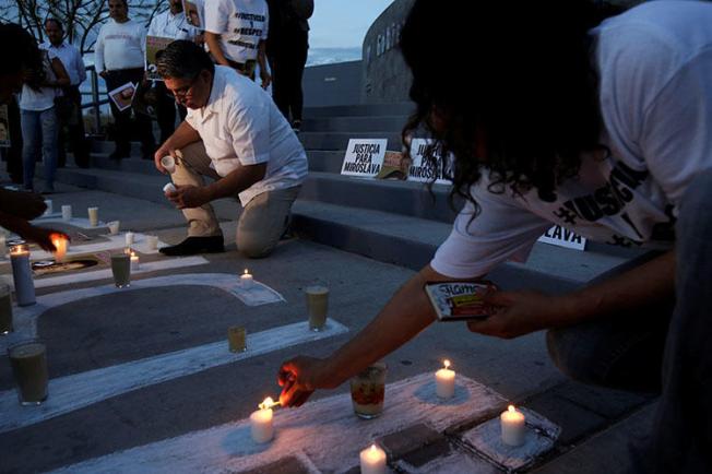 Journalists light candles to mark the first anniversary of the murder of Mexican journalist Miroslava Breach, in March. Crime and politics are dangerous beats for Mexico's journalists. (Reuters/Jose Luis Gonzalez)