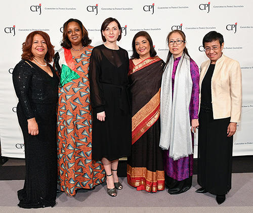 CPJ's 2018 awardees with Meher Tatna, president of the Hollywood Foreign Press Association and the 2018 dinner chair, third from right. (Getty Images/Dia Dipasupil)