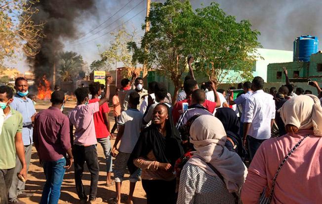 An anti-government rally in Khartoum on January 13. Several journalists are detained and Sudanese authorities are censoring newspapers to try to limit coverage of the unrest. (AP)