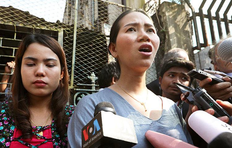 Pan Ei Mon, left, and Chit Su Win, wives of jailed Reuters reporters Wa Lone and Kyaw Soe Oo, talk to media after their appeal was rejected by a court in Yangon, Myanmar, on January 11, 2019. (Reuters/Ann Wang)