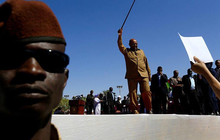 President Omar al-Bashir waves to supporters during a rally in Khartoum on January 9. Sudanese authorities have revoked the credentials of at least six journalists working for international outlets. (Reuters/Mohamed Nureldin Abdallah)