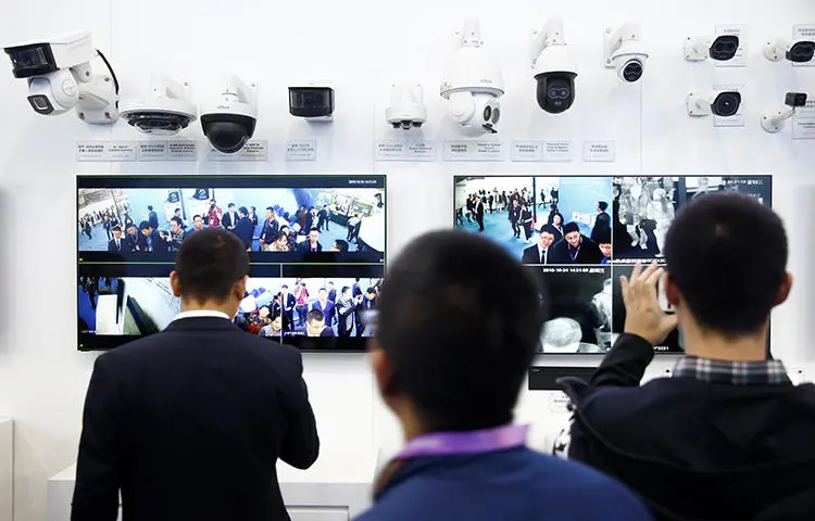 Visitors look at CCTV cameras at the Security China 2018 exhibition on public safety and security in Beijing on October 24, 2018. In a 2018 survey, foreign correspondents in China listed surveillance as their top concern. (Thomas Peter/Reuters)