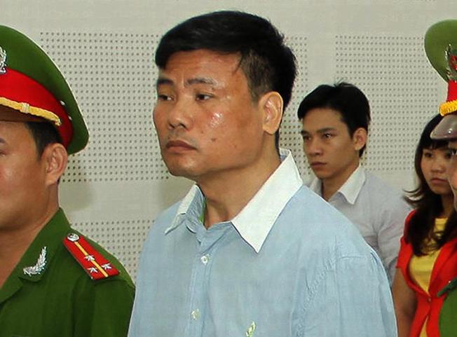 Blogger Truong Duy Nhat stands trial in Vietnam on March 4, 2014. He recently disappeared from Thailand and has resurfaced in a Vietnamese prison. (Vietnam News Agency via AFP)