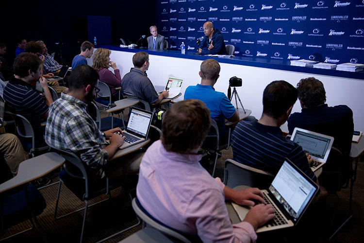 A Penn State news conference in 2014. A sports journalist who helped break the story about convicted Penn State coach Jerry Sandusky says she abandoned Twitter because of threatening messages. (AP/Matt Rourke)