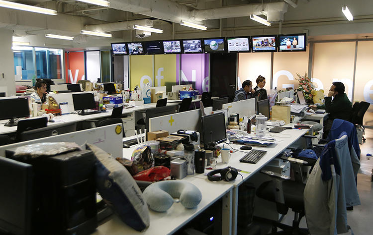 Voice TV station staff work in the newsroom in Bangkok, Thailand, on February 13, 2019. The TV station saw its broadcast license suspended by regulators in the run-up to the country's elections in March. (Sakchai Lalit/AP)
