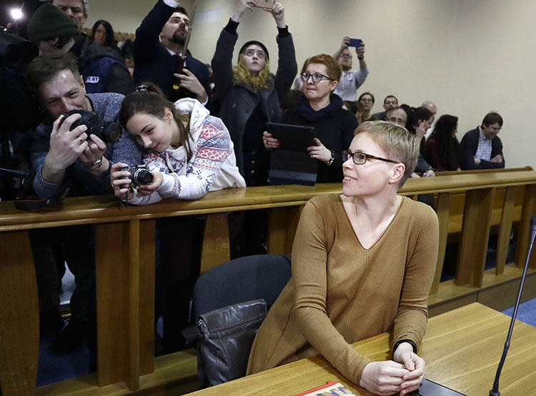 Marina Zolatava, editor-in-chief of the Belarusian independent news site Tut.by, sits in a Minsk court room prior to her preliminary hearing on two charges on February 12. (AP/Sergei Grits)