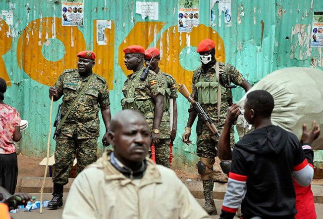 Ugandan military police are seen in Kampala on August 23, 2018. A BBC team was recently arrested while investigating corruption in the country. (Ronald Kabuubi/AP)