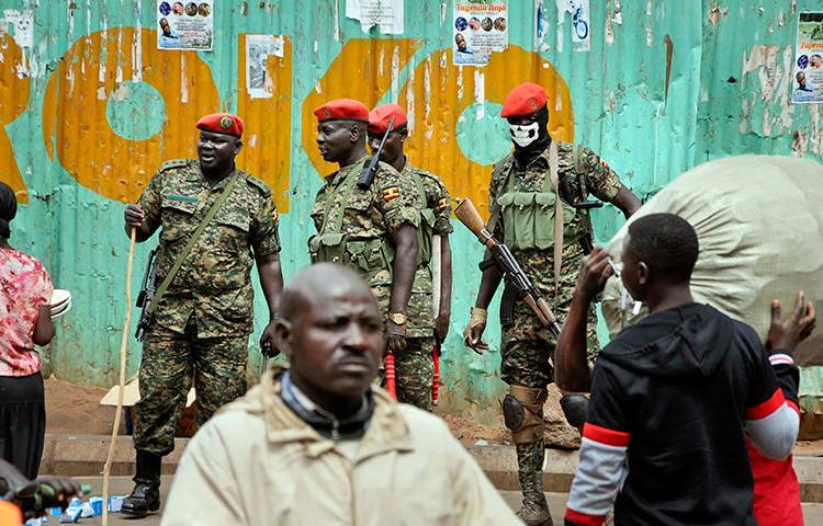 Ugandan military police are seen in Kampala on August 23, 2018. A BBC team was recently arrested while investigating corruption in the country. (Ronald Kabuubi/AP)