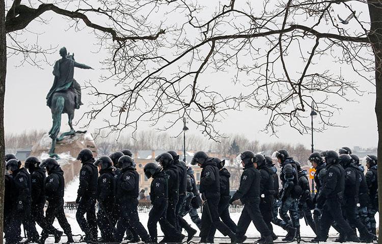 Police walk past a monument to Peter the Great during a rally of opposition supporters in Saint Petersburg on February 10. Jailed Russian journalist Igor Rudnikov is due in court in the city on February 14. (Reuters/Anton Vaganov)