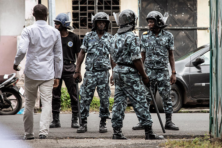Gendarmerie officers stand guard on March 24, 2019, in Moroni, Comoros. Two journalists have been detained without trial in the country since February. (Gianluigi Guercia/AFP)