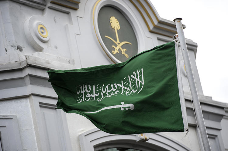 A Saudi flag flies in front of the country's consulate in Istanbul, where columnist Jamal Khashoggi was murdered, in October 2018. In Saudi Arabia, two female journalists who criticized the kingdom's driving ban are on trial. (AFP/Yasin Akgul)