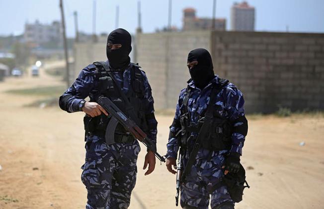 Palestinian members of the Hamas security forces patrol in the town of Nuseirat, central Gaza Strip, on March 22, 2018. Hamas detained at least 3 Palestinian journalists after Gaza cost-of-living protests in mid-March 2019. (AP Photo/Khalil Hamra)