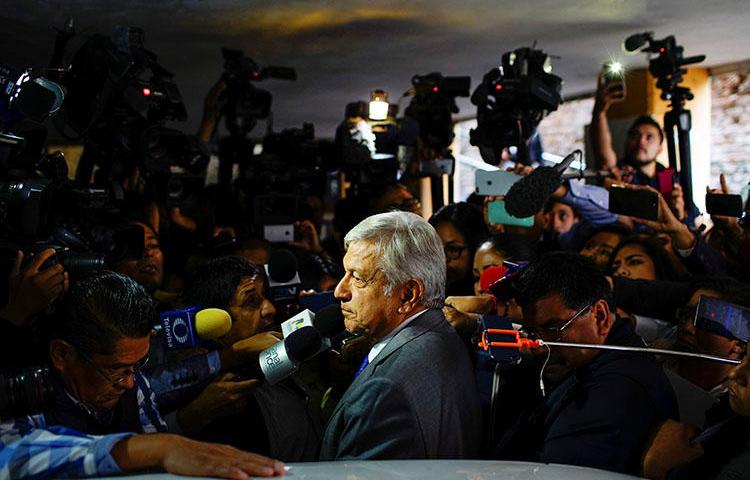 Andrés Manuel López Obrador speaks with journalists in Mexico City in July 2018. The newly elected president said he would rein in massive government spending in the press. (Reuters/Alexandre Meneghini)