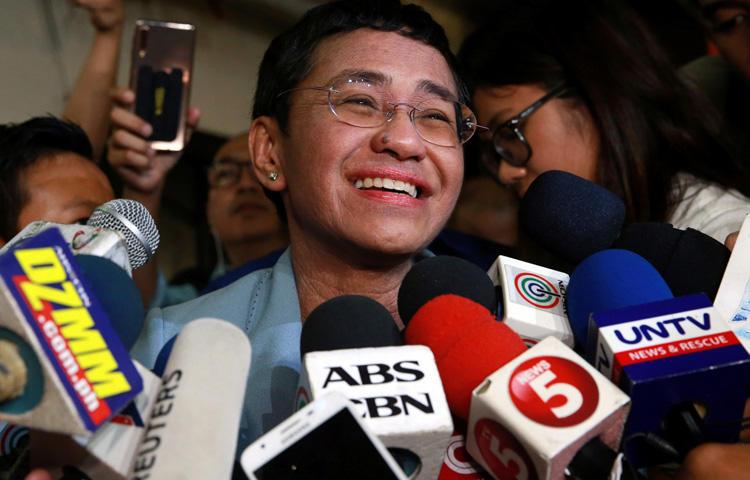 Maria Ressa, executive editor of news website Rappler, speaks to the media after posting bail in a cyber-libel case at a court in Manila City, Philippines, on February 14, 2019. Philippine authorities issued arrest warrants for Ressa and several other Rappler executives on March 28 in a separate case. (Reuters/Eloisa Lopez)
