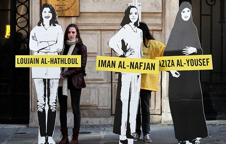 Demonstrators urge Saudi authorities to release jailed women's rights blogger Eman Al Nafjan and activists Loujain al-Hathloul and Aziza al-Yousef outside the Saudi Arabian embassy in Paris on March 8, 2019. Today, Al Nafjan and two activists were released from prison. (Benoit Tessier/Reuters)