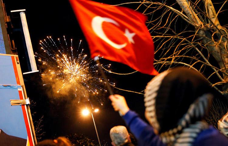 Fireworks are seen in Istanbul on April 1, during elections. A court in the city convicted eight individuals of anti-state charges for their role in a solidarity campaign with the pro-Kurdish newspaper, Özgür Gündem. (Reuters/Kemal Aslan)