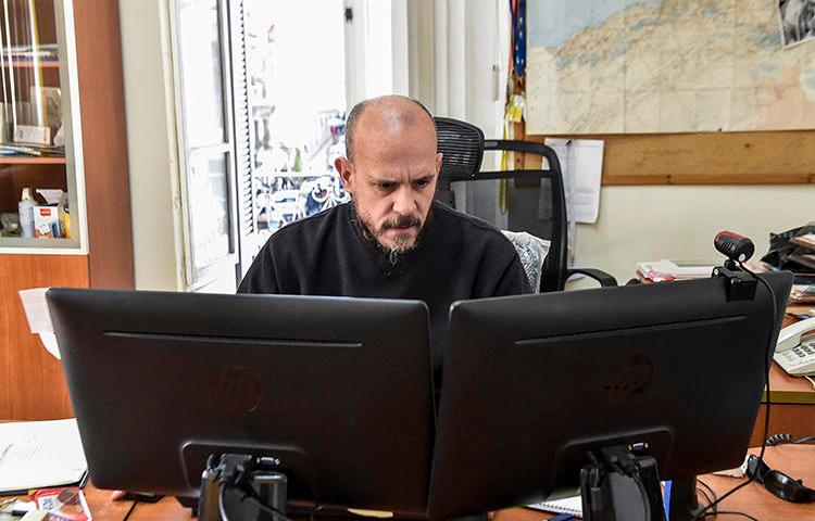 Aymeric Vincenot, AFP's Algiers bureau chief, sits at his office on March 1, 2019. Vincenot was recently expelled from Algiers after authorities declined to renew his press permit. (AFP)