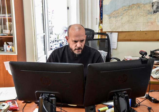 Aymeric Vincenot, AFP's Algiers bureau chief, sits at his office on March 1, 2019. Vincenot was recently expelled from Algiers after authorities declined to renew his press permit. (AFP)