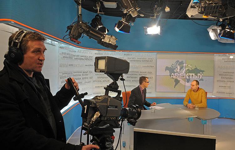 Journalists broadcast from the Belsat TV studio in Warsaw, Poland, on January 31, 2011. The broadcaster's Minsk, Belarus, offices were recently raided by police in a slander case. (AFP/Janek Skarzynski)