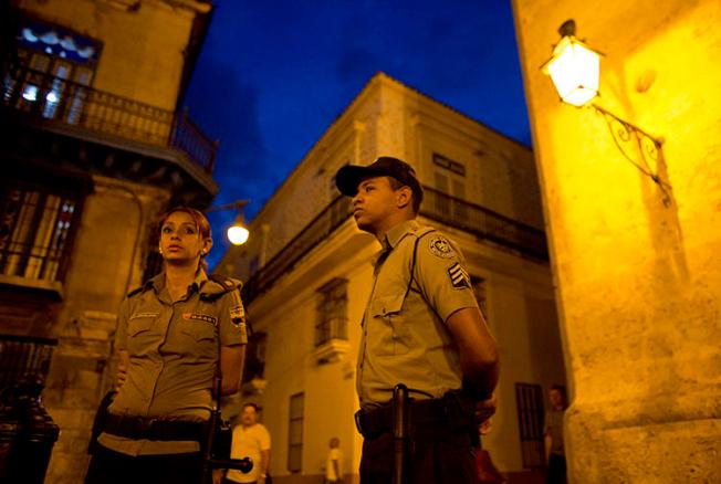 Police officers are seen in Havana, Cuba, on March 18, 2016. Journalist Augusto César San Martín was recently detained, fined, and had his equipment confiscated in Havana. (AP/Rebecca Blackwell)