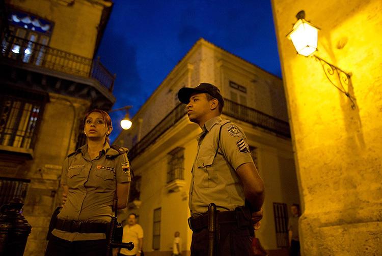 Police officers are seen in Havana, Cuba, on March 18, 2016. Journalist Augusto César San Martín was recently detained, fined, and had his equipment confiscated in Havana. (AP/Rebecca Blackwell)