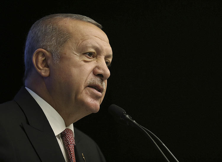 President Recep Tayyip Erdoğan, pictured giving a speech in Ankara on April 18, lashed out at a Financial Times report on Turkey's economy. (Presidential Press Service via AP/Pool)