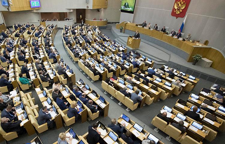 Russian lawmakers are seen in the State Duma on May 22, 2018. The Duma recently considered amendments that would restrict foreign print media in the country. (AP/Pavel Golovkin)