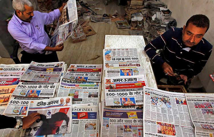 A man reads a newspaper in Allahabad, India, on November 9, 2016. A Bengaluru court recently passed a gag order barring the Indian press and international social media networks from publishing derogatory remarks about a local political candidate. (Reuters/Jitendra Prakash)