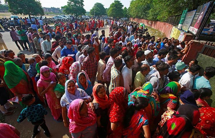 Voters are seen outside a polling station during the final phase of the general election in Chandigarh, India, on May 19, 2019. (Reuters/Ajay Verma)