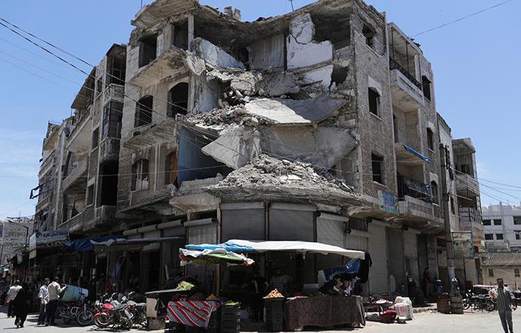 A damaged building is seen in Idlib, Syria, on May 25, 2019. (Reuters/Khalil Ashawi)