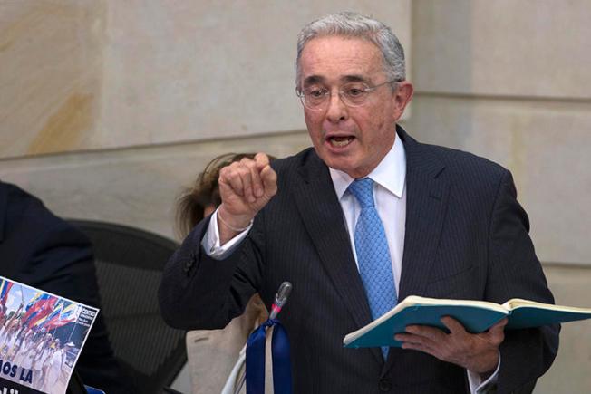 Senator Alvaro Uribe Velez is seen at the National Congress in Bogota, Colombia, on April 30, 2019. Uribe and his allies have recently filed defamation suits and retraction requests against journalist Daniel Coronell. (AFP/Diana Sanchez)