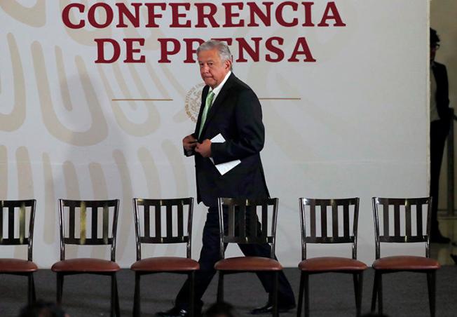 President Andrés Manuel López Obrador arrives for his daily press briefing at the National Palace in Mexico City, on April 12. Journalists in Mexico say they are harassed online after being criticized by the president. (AP/Marco Ugarte)