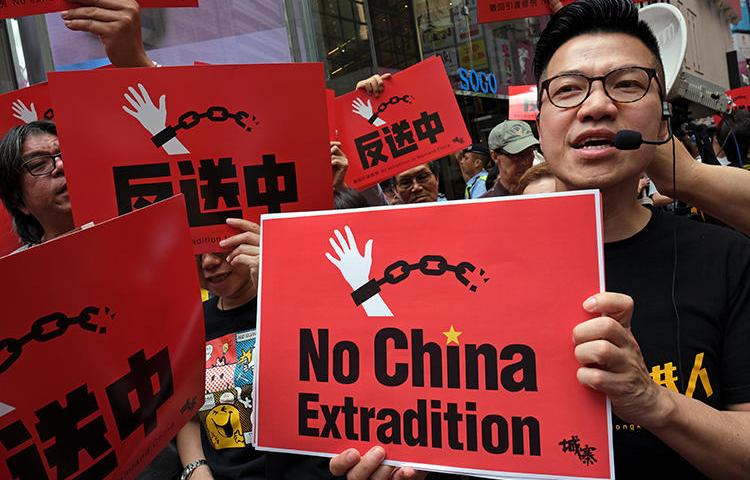 Demonstrators protest a proposed extradition bill in Hong Kong on April 28, 2019. CPJ has called for the bill to be withdrawn or modified. (Reuters/Tyrone Siu)