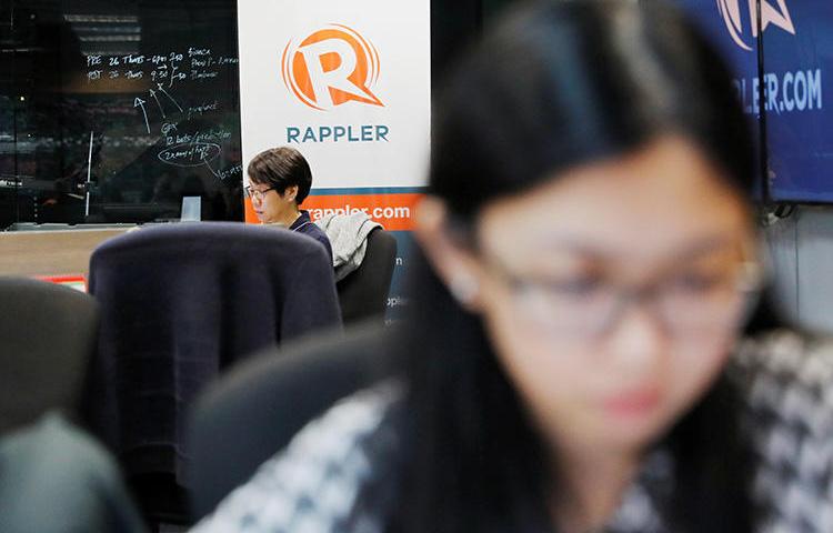 Journalists pictured in the Manila offices of Rappler, in January 2018. The outlet is one of four Philippine media groups smeared in a campaign that alleges they are in the pay of the CIA. (Reuters/Dondi Tawatao)