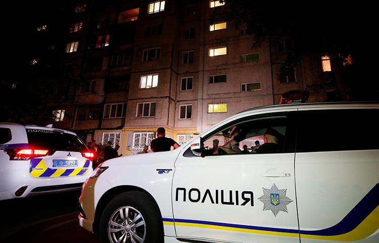 Police cars are seen in Kiev, Ukraine, on May 29, 2018. A journalist was recently attacked in Cherkasy and is now in a coma. (Reuters/Gleb Garanich)