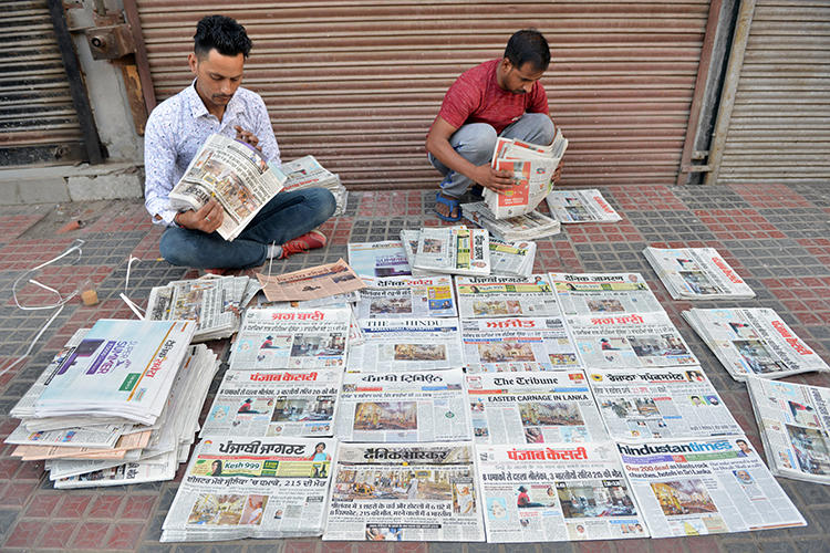 Newspaper distributors are seen in Amritsar, India, on April 22, 2019. The Indian government recently stopped placing advertisements in three major newspaper groups in apparent retaliation for their coverage. (AFP/Narinder Nanu)