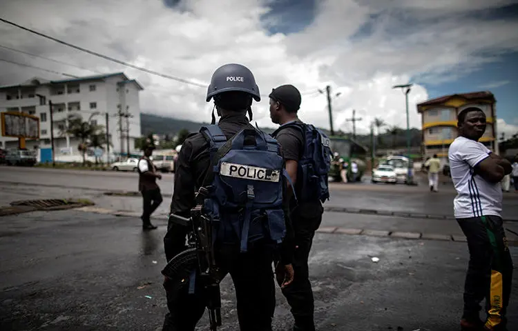 Cameroonian police officers are seen on October 3, 2018. Police recently arrested journalist Paul Chouta on criminal defamation and false news charges. (AFP/Marco Longari)
