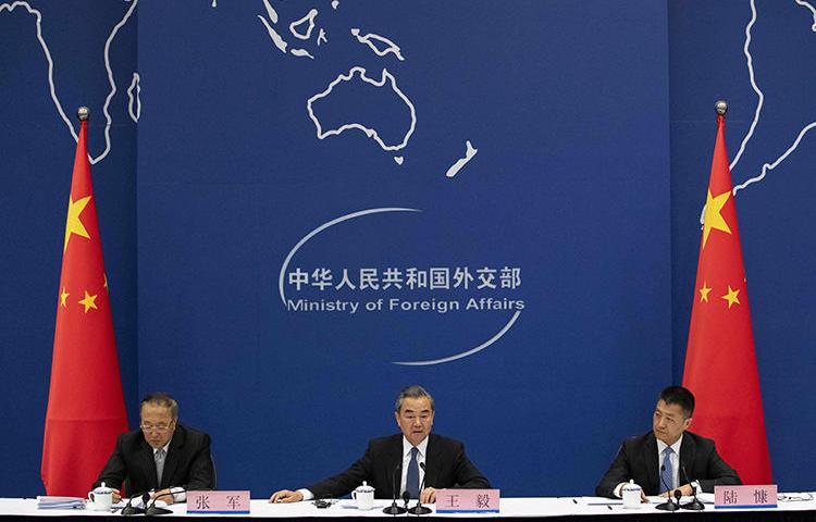 China's Foreign Minister Wang Yi (center) is seen in Beijing on April 19, 2019. China's Ministry of Foreign Affairs recently denied a visa to reporter Bethany Allen-Ebrahimian. (AFP/Nicolas Asfouri)