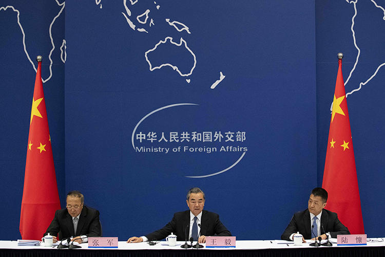 China's Foreign Minister Wang Yi (center) is seen in Beijing on April 19, 2019. China's Ministry of Foreign Affairs recently denied a visa to reporter Bethany Allen-Ebrahimian. (AFP/Nicolas Asfouri)