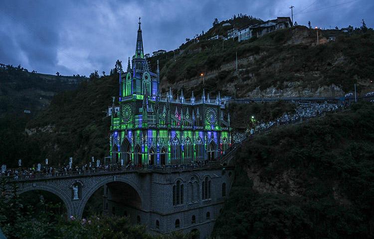 Lights illuminate the Roman Catholic church Las Lajas, in the Colombian department of Nariño in January 2019. A radio journalist in the region was shot dead on June 11. (AFP/Juan Barreto)